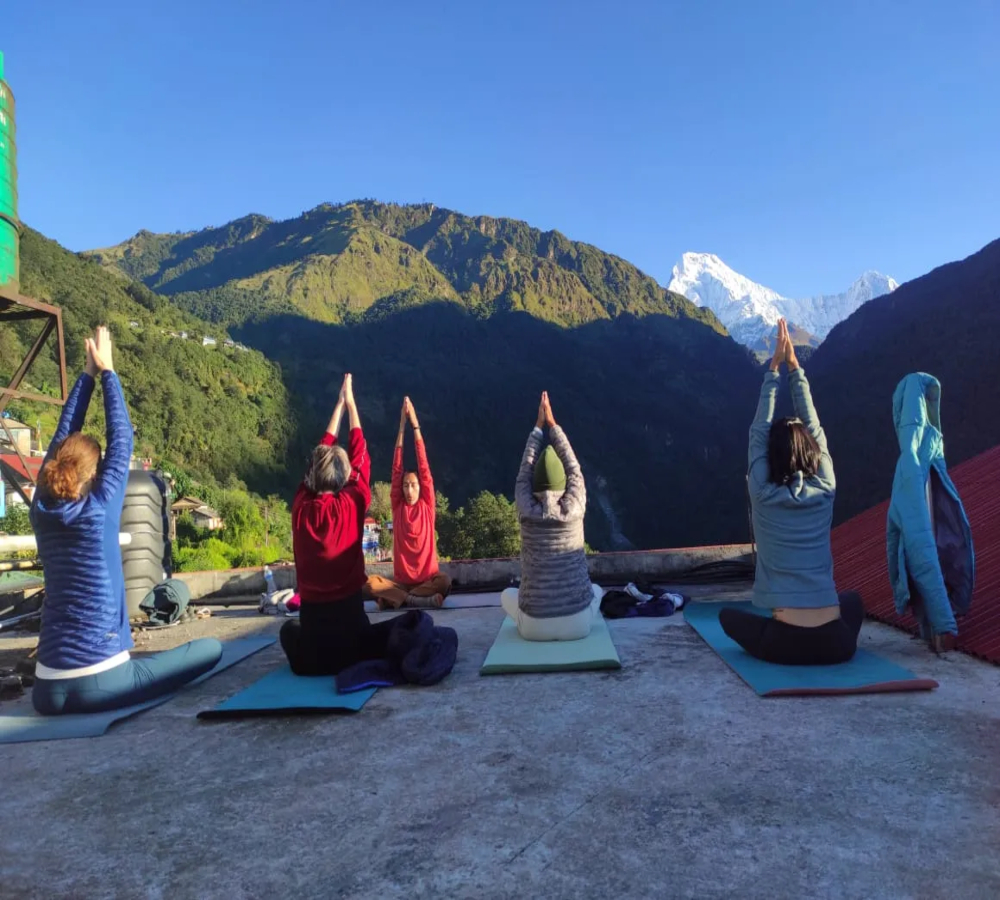 Yoga pose training at Atmashree yoga retreat pokhara Nepal